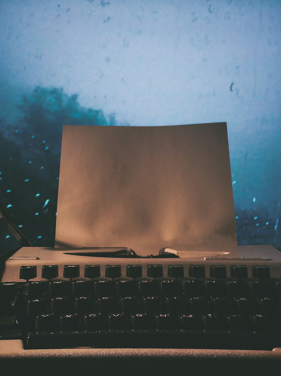 writer typing at night