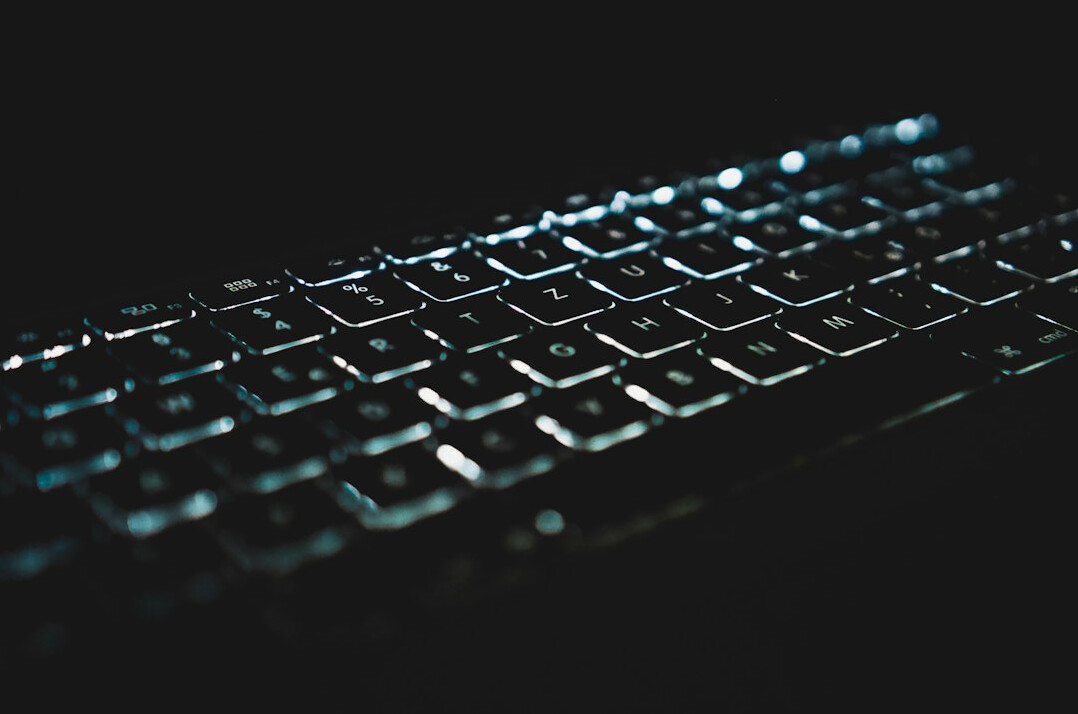 writer typing at night